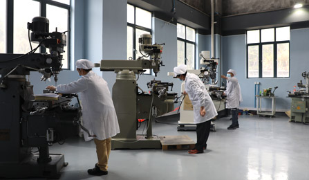 Engineers producing a product using industrial machines